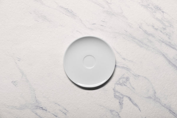 Ariane 5 1/8" Vital Coupe - Warm White Porcelain Coupe Elevated Espresso Saucer - 12/Case (AVCARN000014013) - iFoodservice Online