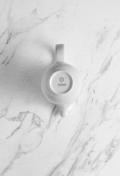 Ariane 5 Oz Vital Coupe - Warm White Porcelain Coupe Creamer With Handle - 12/Case (AVCARN000064015) - iFoodservice Online