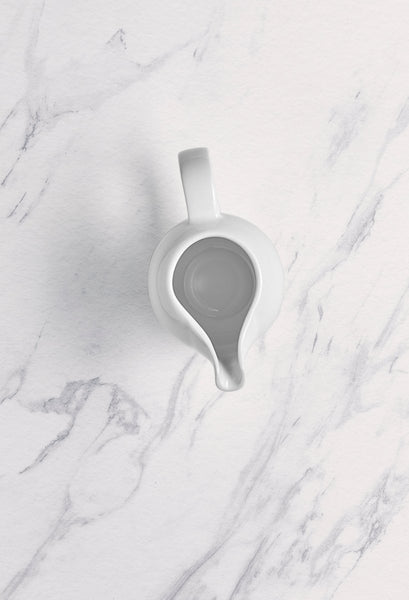 Ariane 5 Oz Vital Coupe - Warm White Porcelain Coupe Creamer With Handle - 12/Case (AVCARN000064015) - iFoodservice Online