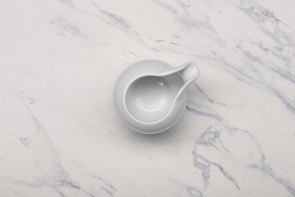 Ariane 5 Oz Vital Coupe - Warm White Porcelain Coupe Creamer Without Handle - 12/Case (AVCARN000065015) - iFoodservice Online