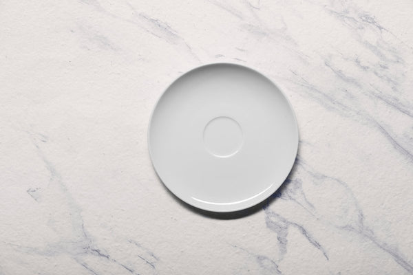 Ariane 6 2/7" Vital Coupe - Warm White Porcelain Coupe Elevated Tea/Coffee Saucer - 12/Case (AVCARN000014016) - iFoodservice Online