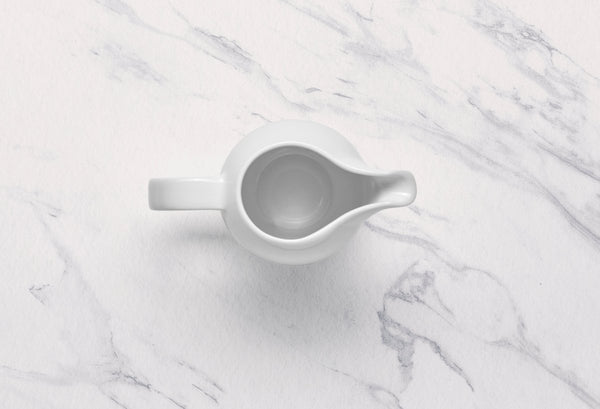 Ariane 8 4/9 Oz Vital Coupe - Warm White Porcelain Creamer With Handle - 6/Case (AVCARN000064025) - iFoodservice Online