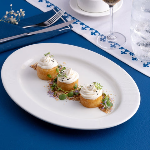 Ariane Prime 12 3/5'' x 8 2/3'' Orba White Porcelain Oval Platter - 6/Case (APRARN121015032) - iFoodservice Online