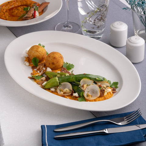 Ariane Prime 12 3/5'' x 8 2/3'' Prime - Warm White Porcelain Oval Platter - 6/Case (APRARN000015032) - iFoodservice Online