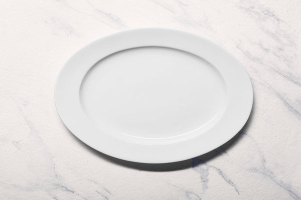 Ariane Prime 12 3/5'' x 8 2/3'' Prime - Warm White Porcelain Oval Platter - 6/Case (APRARN000015032) - iFoodservice Online