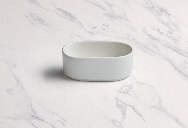 Ariane Prime 3 1/2" x 2" White Eclipse Porcelain Sugar Pack Holder - 12/Case (APRARN120077001) - iFoodservice Online