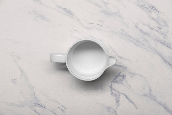 Ariane Prime 8 4/9 Oz White Eclipse Porcelain Creamer With Handle - 12/Case (APRARN120064025) - iFoodservice Online