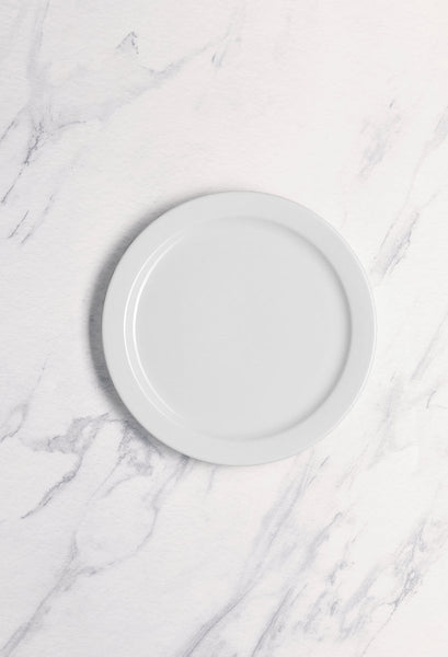 Ariane Prime 9 4/9" Prime - Warm White Porcelain Flat Plate Banquate Small Rim - 12/Case (APRARN000018024) - iFoodservice Online