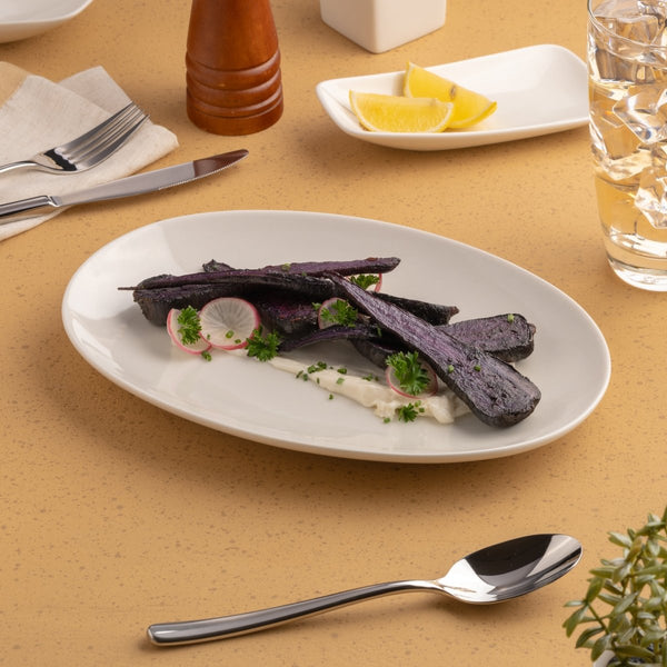 Ariane Vital Coupe 10 1/4" Vital Coupe - Warm White Porcelain Coupe Oval Plate - 12/Case (AVCARN000015026) - iFoodservice Online