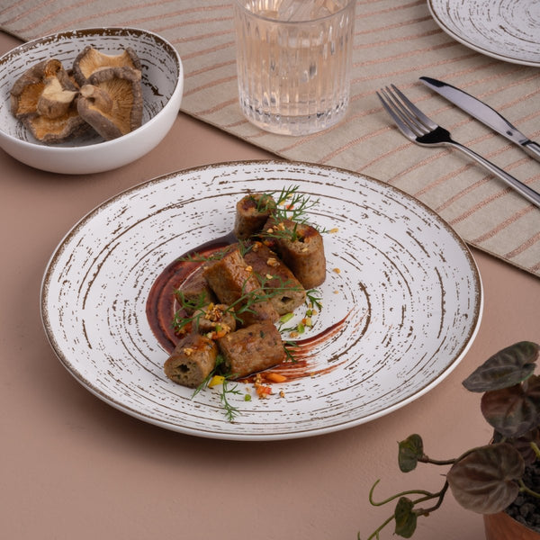 Ariane Vital Coupe 10 5/8" Tornado - White Matt Porcelain Coupe Round Rimless Plate - 6/Case (AVCARN427011027) - iFoodservice Online