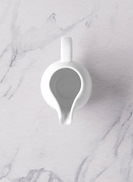 Ariane Vital Coupe 11 5/6 Oz Vital Coupe - Warm White Porcelain Coupe Creamer With Handle - 6/Case (AVCARN000064035) - iFoodservice Online