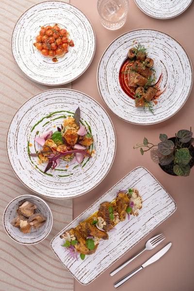 Ariane Vital Coupe 12 1/5" Tornado - White Matt Porcelain Coupe Round Rimless Plate - 6/Case (AVCARN427011031) - iFoodservice Online