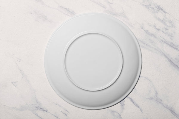 Ariane Vital Coupe 12 1/5" Vital Coupe - Warm White Porcelain Coupe Round Rimless Plate - 6/Case (AVCARN000011031) - iFoodservice Online