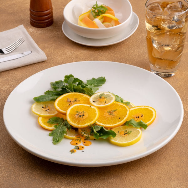 Ariane Vital Coupe 12 1/5" Vital Coupe - Warm White Porcelain Coupe Round Rimless Plate - 6/Case (AVCARN000011031) - iFoodservice Online