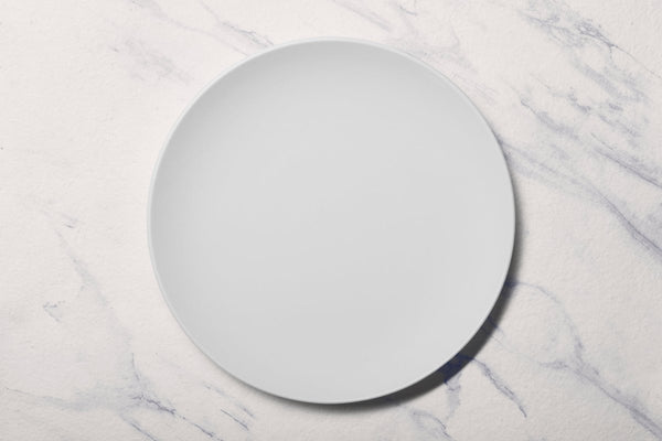 Ariane Vital Coupe 12 1/5" Vital Coupe - Warm White Porcelain Coupe Round Rimless Plate - 6/Case (AVCARN000011031) - iFoodservice Online