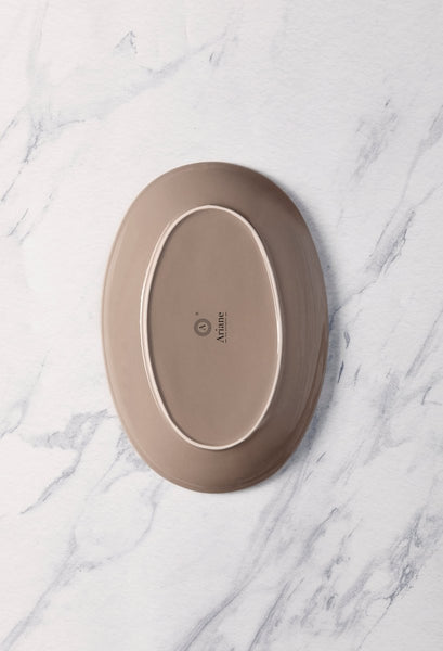 Ariane Vital Coupe 12 3/5" Splash Beige Porcelain Coupe Oval Plate - 6/Case (AVCARN257015032) - iFoodservice Online