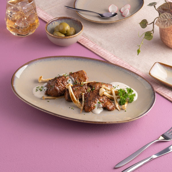 Ariane Vital Coupe 12 3/5" Splash Beige Porcelain Coupe Oval Plate - 6/Case (AVCARN257015032) - iFoodservice Online