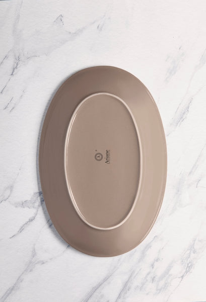 Ariane Vital Coupe 14 1/6" Splash Beige Porcelain Coupe Oval Plate - 6/Case (AVCARN257015036) - iFoodservice Online