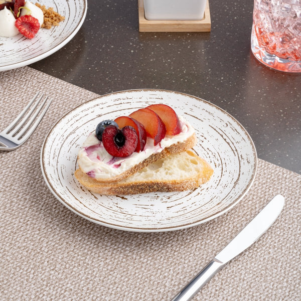 Ariane Vital Coupe 7" Tornado - White Matt Porcelain Coupe Round Rimless Plate - 12/Case (AVCARN427011018) - iFoodservice Online