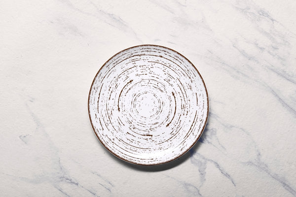 Ariane Vital Coupe 7" Tornado - White Matt Porcelain Coupe Round Rimless Plate - 12/Case (AVCARN427011018) - iFoodservice Online