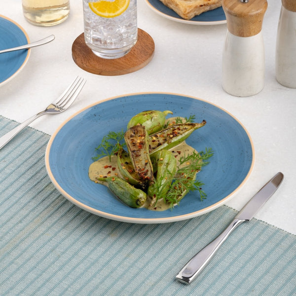 Ariane Vital Coupe 7" Twister Blue Porcelain Coupe Round Rimless Plate - 12/Case (AVCARN264011018) - iFoodservice Online