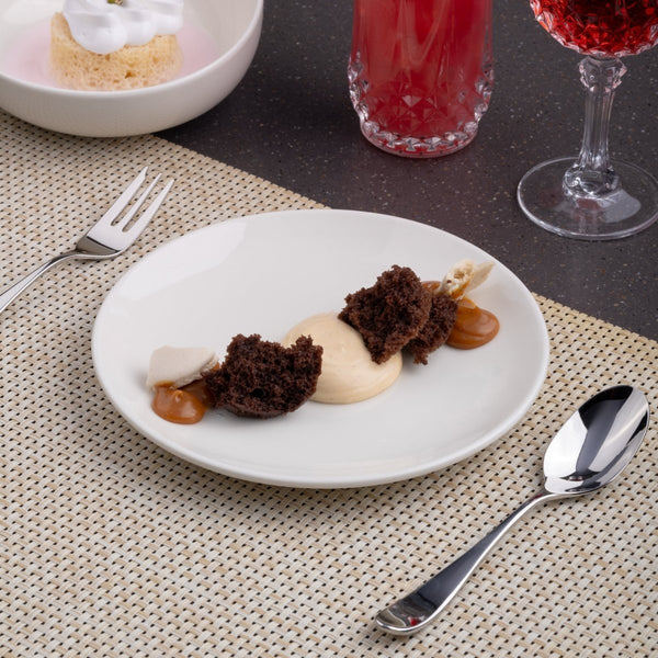 Ariane Vital Coupe 7" Vital Coupe - Warm White Porcelain Coupe Round Rimless Plate - 12/Case (AVCARN000011018) - iFoodservice Online