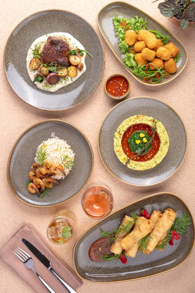 Ariane Vital Coupe 8 1/4" Freckles Porcelain Coupe Round Rimless Plate - 12/Case (AVCARNC97011021) - iFoodservice Online