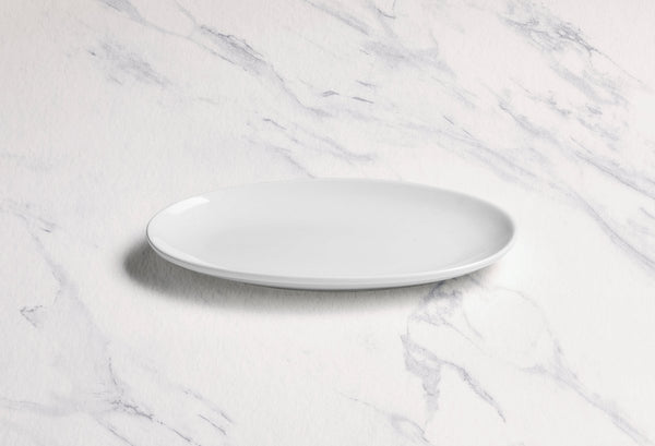 Ariane Vital Coupe 8 1/4" Vital Coupe - Warm White Porcelain Coupe Oval Plate - 12/Case (AVCARN000015021) - iFoodservice Online