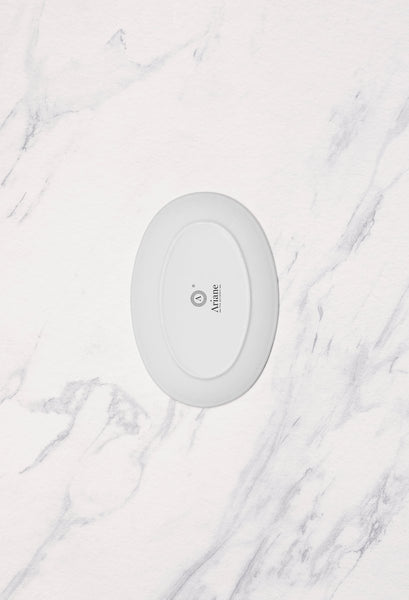 Ariane Vital Coupe 8 1/4" Vital Coupe - Warm White Porcelain Coupe Oval Plate - 12/Case (AVCARN000015021) - iFoodservice Online