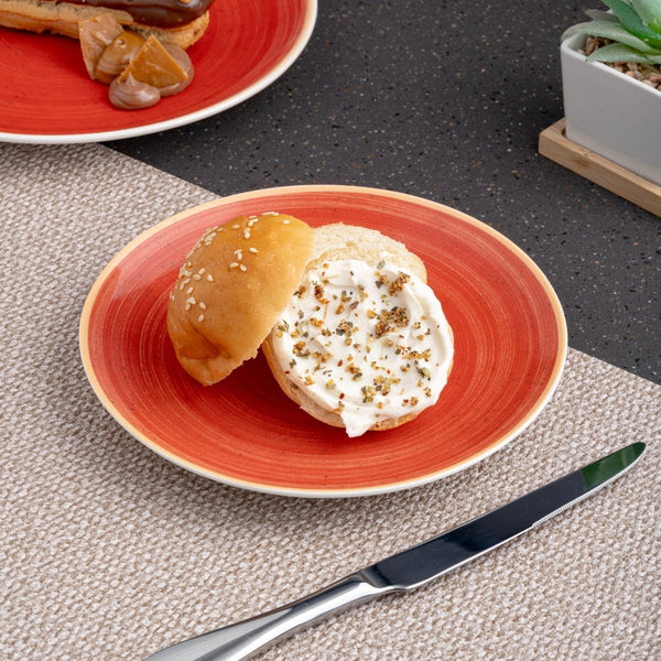 Ariane Vital Coupe 9 4/9" Twister Red Porcelain Coupe Round Rimless Plate - 6/Case (AVCARN204011024) - iFoodservice Online