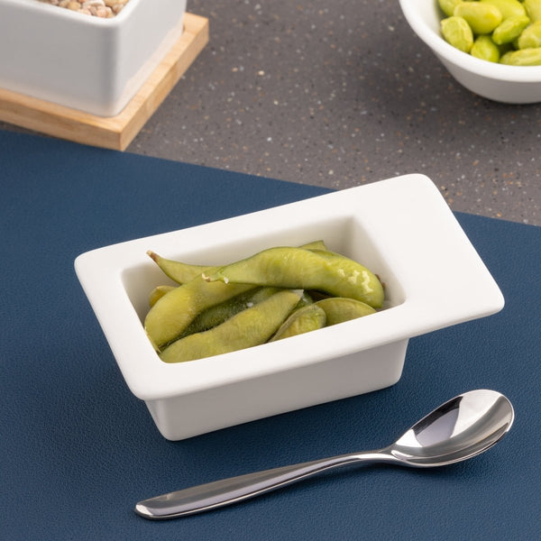 Ariane White 4 5/7" x 2 7/8” Miniature Porcelain Deep Rectangle Bowl With Rim - 18/Case (AMNARN000101019) - iFoodservice Online